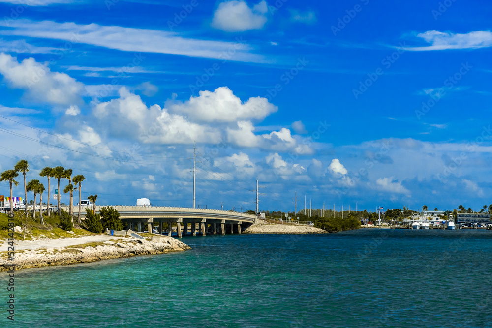 Bridge in Islamorada, Florida, with ocean and blue sky with clouds