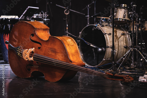 Wall Mural Acoustic double bass on stage with drums on background during a jazz concert