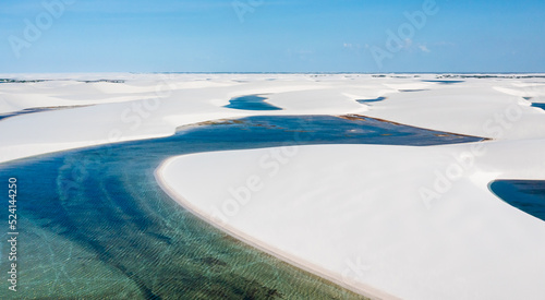 aerial view of the white sand dunes of Lencois Maranhenses with rain water pools © Agata Kadar