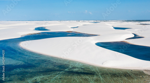 aerial view of the white sand dunes of Lencois Maranhenses with rain water pools photo