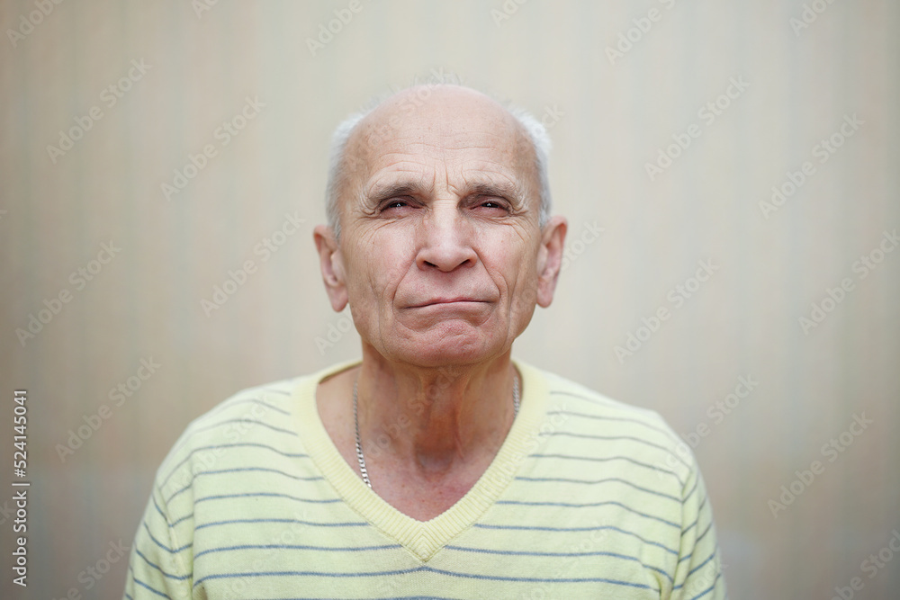 Portrait hypocritical gray haired man looking with screw up eyes. Old man view. Portrait hypocritical gray haired man looking with screw up eyes. Old man view.