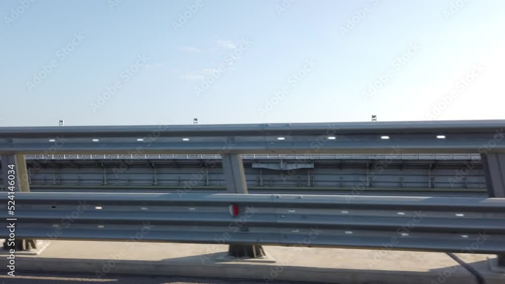 Landscape with a moving road barrier on the Crimean Bridge Landscape with a moving road barrier on the Crimean Bridge