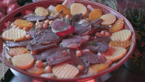 Close-up of national Kazakh dish Beshbarmak made of veggies photo
