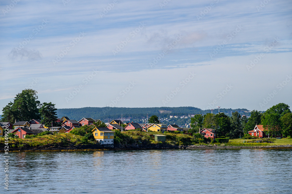 Colorful red and yellow cottages on the Oslo Fjord coastline, Norway
