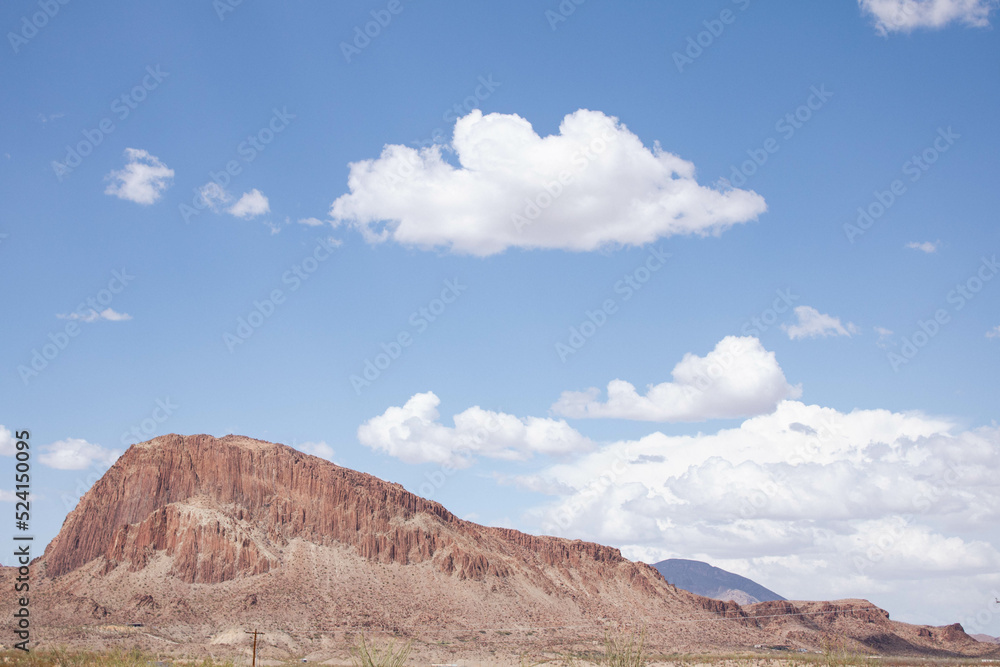 red rocks and sky in the desert with clouds