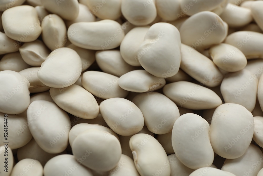 Pile of uncooked white beans as background, closeup Pile of uncooked white beans as background, closeup