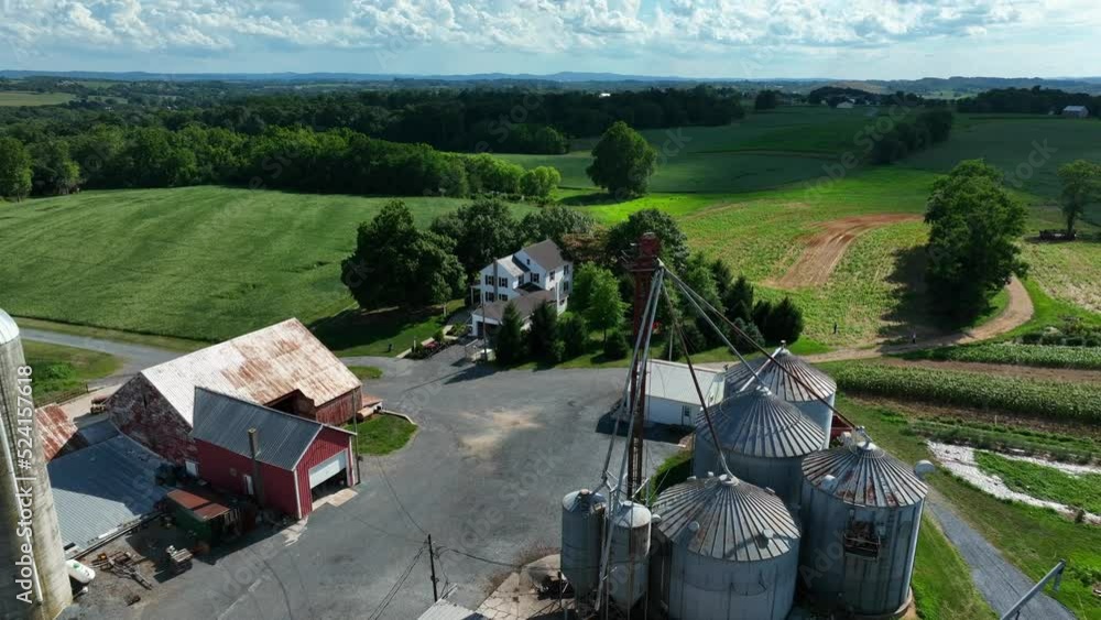 Pullback reveal of poultry chicken farm operation. Aerial in summer season. Pullback reveal of poultry chicken farm operation. Aerial in summer season.