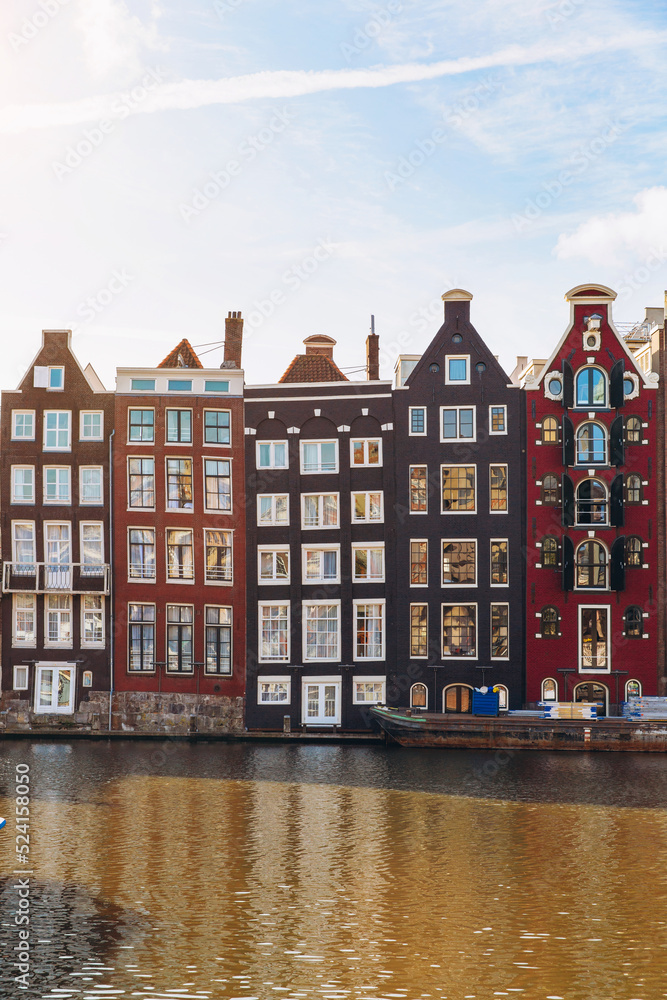Traditional houses on canal in Amsterdam, Netherlands.