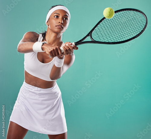 Tennis, sportswear and woman playing tournament with copy space background. Sporty, active and professional athlete playing a game. Competition and serious tennis player keeps focus on the court. © Talia M/peopleimages.com