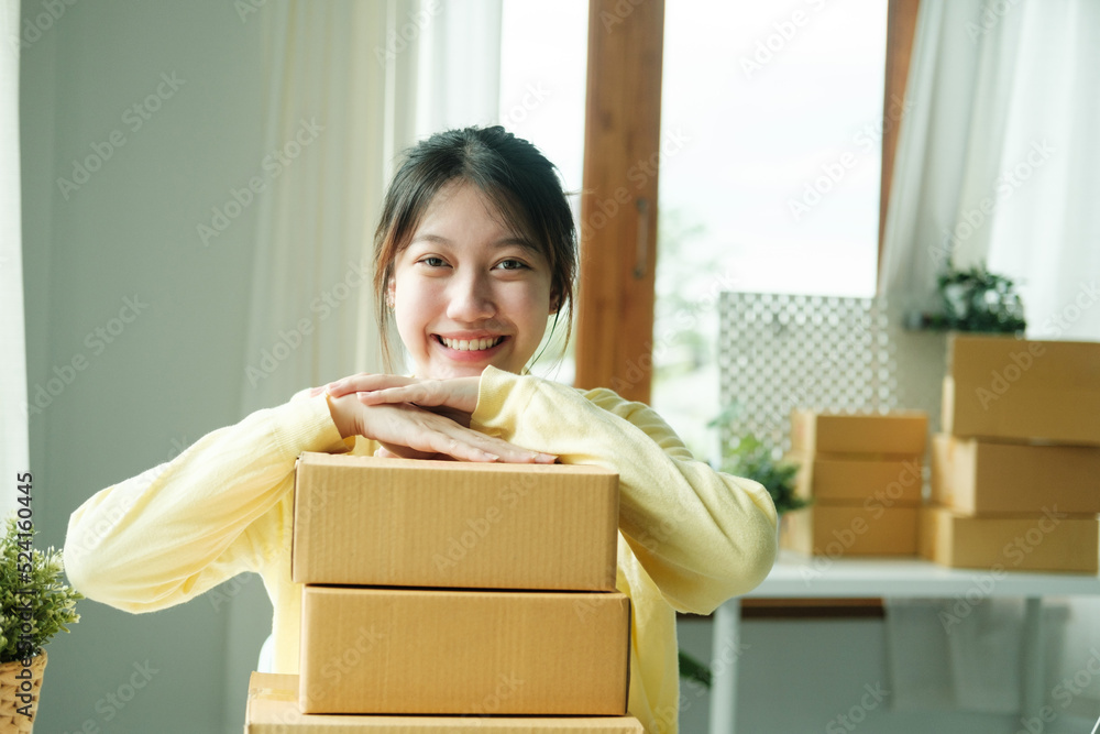 Young happy asian SME business woman use digital checking customer order. Young happy asian SME business woman use digital checking customer order.