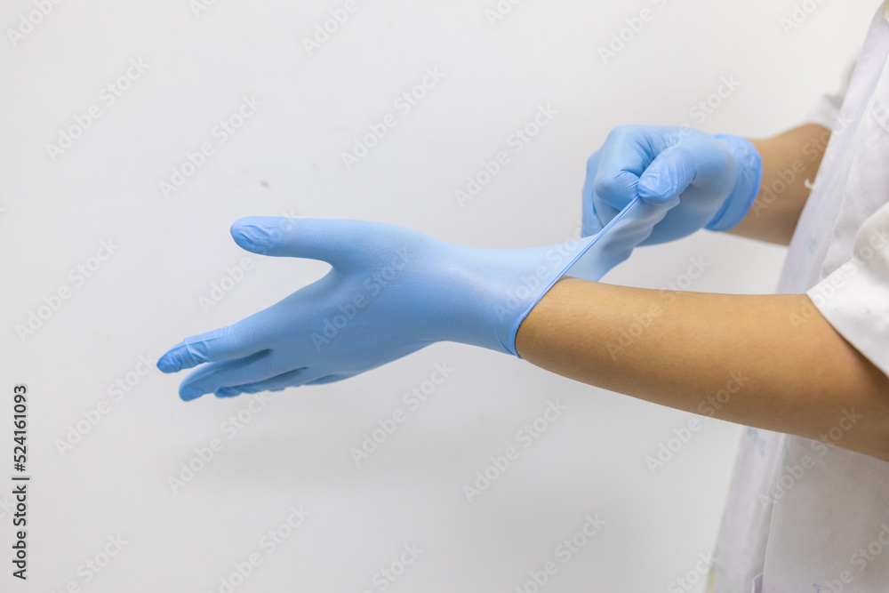Blue gloves that employees wear to work to prevent the risk of germs. Blue gloves that employees wear to work to prevent the risk of germs.