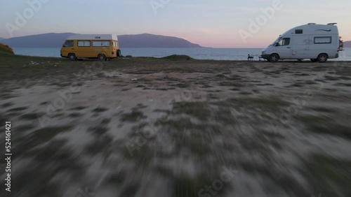 Fast aerial forward between two campers revealing beautiful beach and sea, Vlore, Albania. Travel concept photo