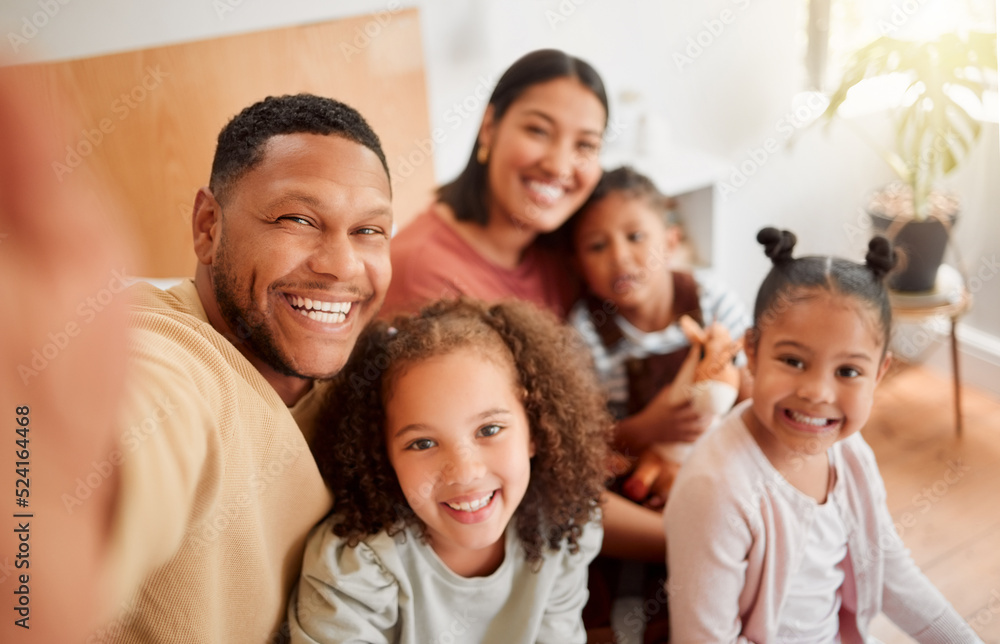 Happy family taking selfie, having fun, relaxing and bonding in living room at home. Smiling, carefree parents enjoying time with children indoors, being affectionate and together on the weekend Happy family taking selfie, having fun, relaxing and bonding in living room at home. Smiling, carefree parents enjoying time with children indoors, being affectionate and together on the weekend