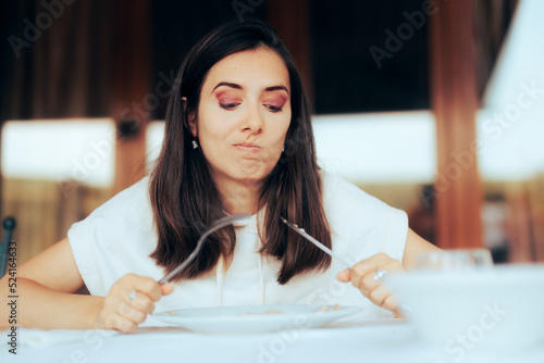 Picky Eater Having Problems Finishing a Course in a Restaurant. Unhappy customer complaining about her food order in a diner
 photo