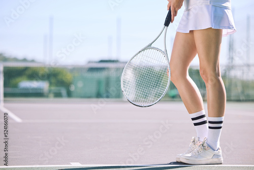 Legs of a female tennis player practicing or training for a match outdoors on the court on a sunny day. Active, fit and athletic female athlete or sportswoman playing a sport for a club © Michael Cunningham/peopleimages.com