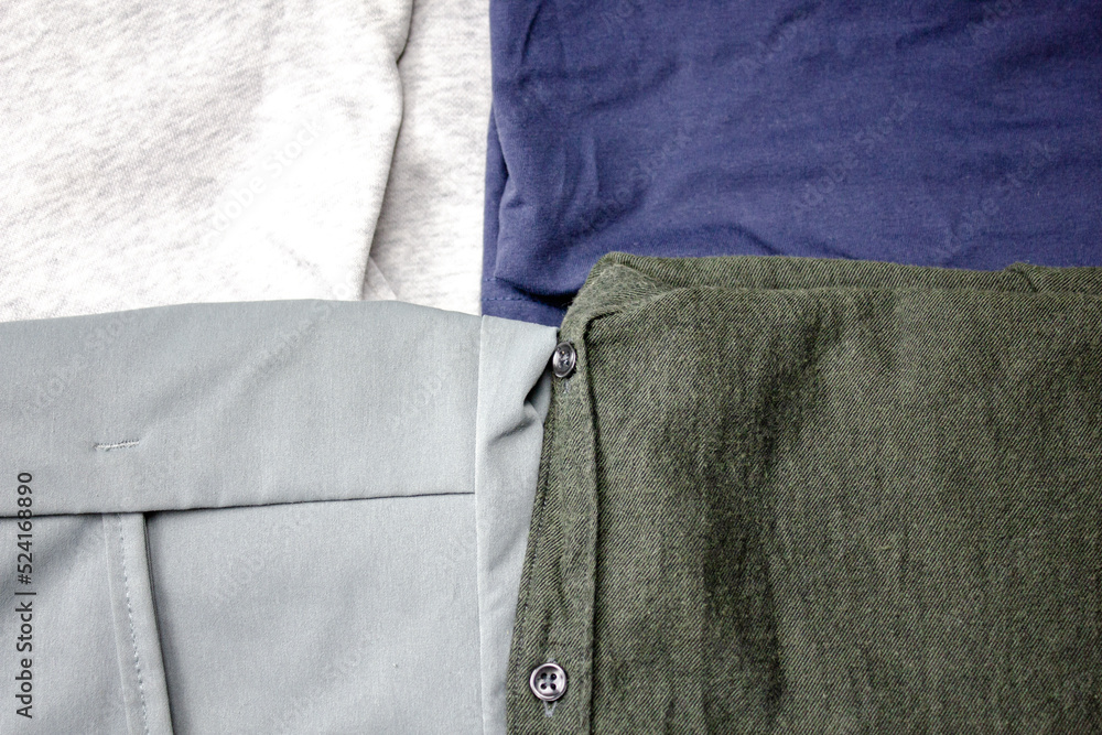 Stack of clothes.Casual wear.Folded assorted clothes. Stack of clothes.Casual wear.Folded assorted clothes.