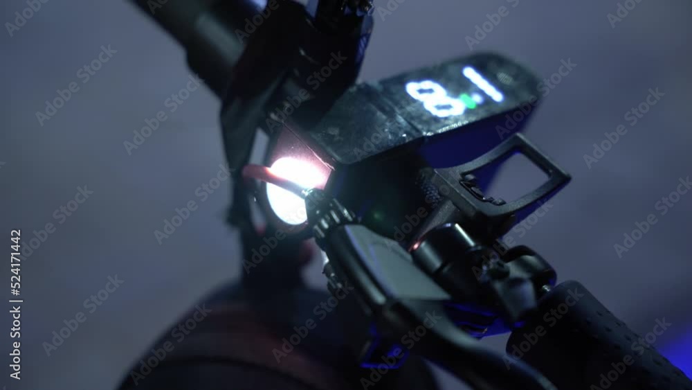 Cool flashlight mounted on an electric scooter at night Cool flashlight mounted on an electric scooter at night