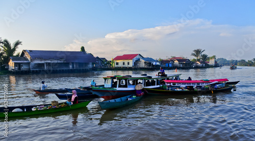 Banjarmasin, July 2022. Busy Lok Baintan floating market in the morning. Merchants offer their wares to tourists