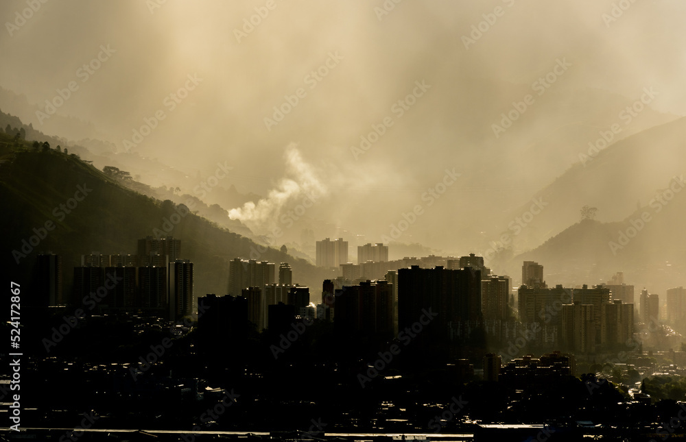 Smog contamination pollution in the mountains of the city of medellin colombia antioquia red and dirt