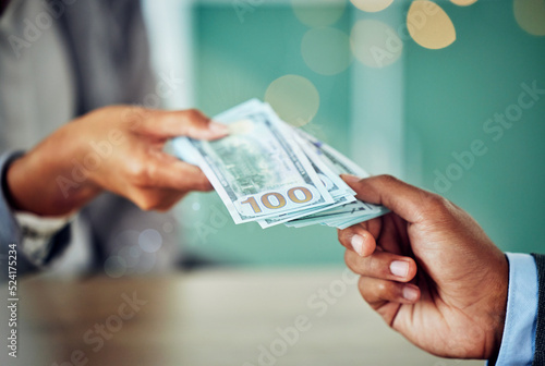 Hands, dollars and businessmen exchanging cash at a bank, making a purchase or deal. Closeup of money, investment and business doing its accounting. African entrepreneur paying for a service or loan.