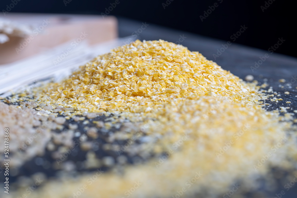 Finely crushed corn kernels into flakes for making porridge Finely crushed corn kernels into flakes for making porridge