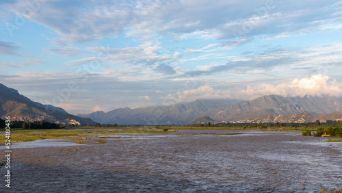 Flooded Swat River washes away agriculture fields photo