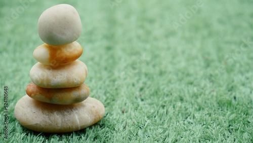 Canvas Print The Balance Stones are stacked as pyramids in a soft natural bokeh background, representing the calm philosophical concept of Jainism's wellness