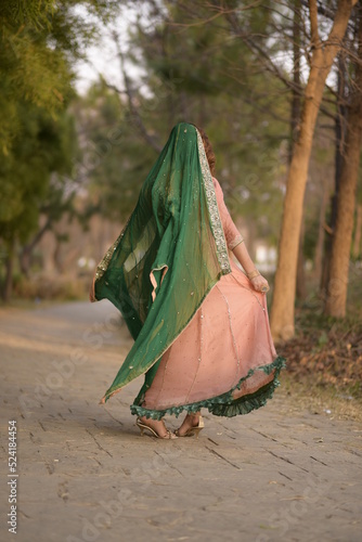 Islamabad, Pakistan: January 1st, 2021: Beautiful trendy woman in wedding designer dress.