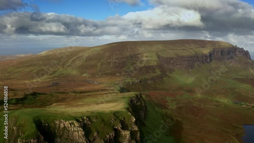 Aerial View of Pristine Landscape, Isle of Skye Scotland UK, Hills and Grassland Above Countryside Lake on Sunnu Day photo