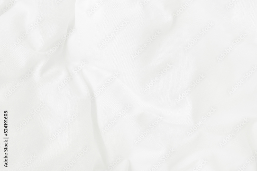 Texture of white blanket and bedding sheet with crumpled or messy in bedroom after wake up.