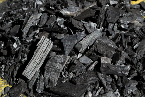 Black charcoal for cooking, suitable for grilling food.