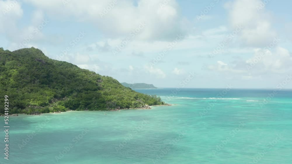 Aerial view of Seychelles. Coastline with mountain and jungle on an island in the Indian Ocean. High quality 4k footage Aerial view of Seychelles. Coastline with mountain and jungle on an island in the Indian Ocean. High quality 4k footage