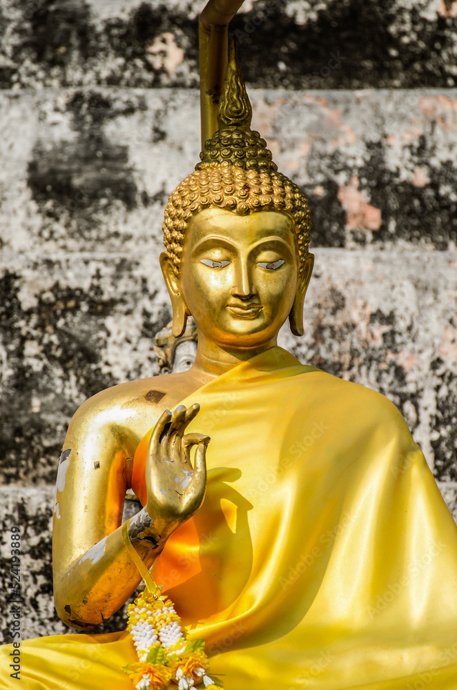 Ancient Golden Buddha statue with background