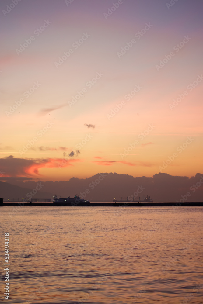 Sunset over the mountains and the coast - bay of Aegean Sea in Izmir, Turkey with copy space Sunset over the mountains and the coast - bay of Aegean Sea in Izmir, Turkey with copy space