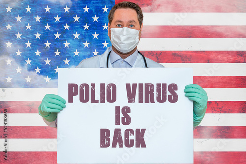 Inscription POLIO VIRUS IS BACK.Doctor holds mockup.detection of poliomyelitis virus.New polio virus infects dozens in USA.US flag background. photo