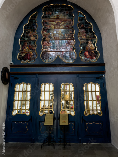 Gdansk, Poland, May 15, 2022: Interior of St. Mary's Basilica in Gdansk, Poland. Decorative door with a stained glass window