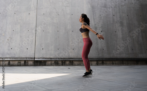 Fototapeta Naklejka Na Ścianę i Meble -  Asian woman exercise fitness bobby jump