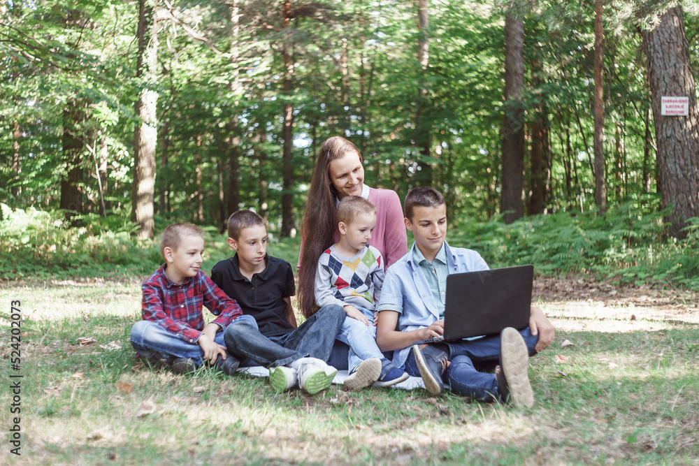 mother with children on a picnic in nature mother with children on a picnic in nature