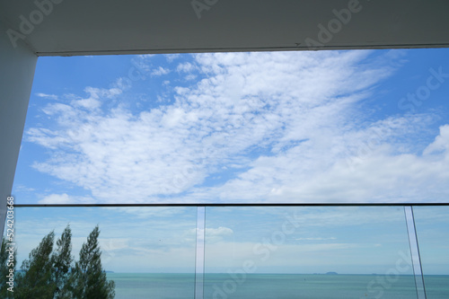 glass balcony with sea and sky background