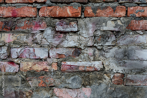 Old dirty brick wall. Textured surface. Broken wall. Wall from red bricks.