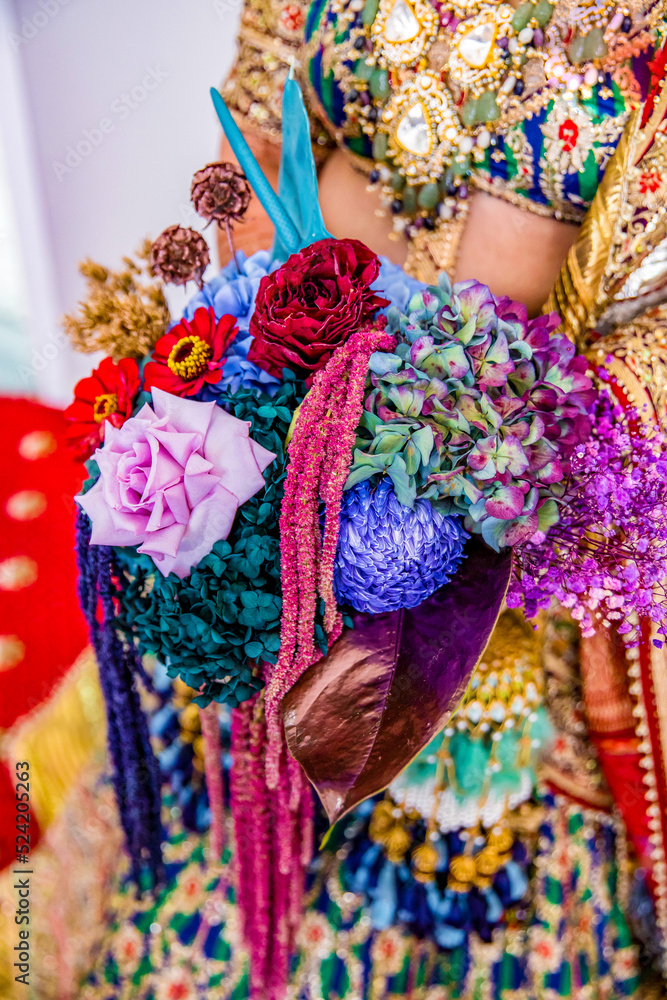 Indian Punjabi bride's holding beautiful wedding flowers close up