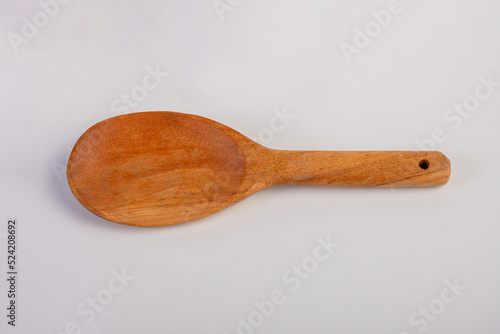 rustic wooden spoon isolated on white background 