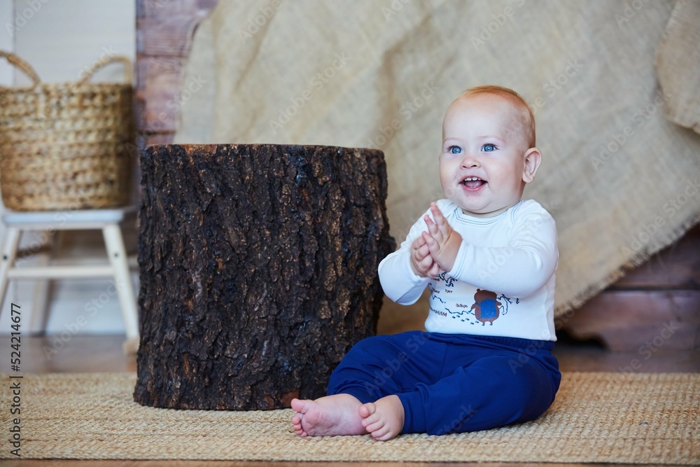 Naklejka premium A small newborn baby boy. The concept of childhood