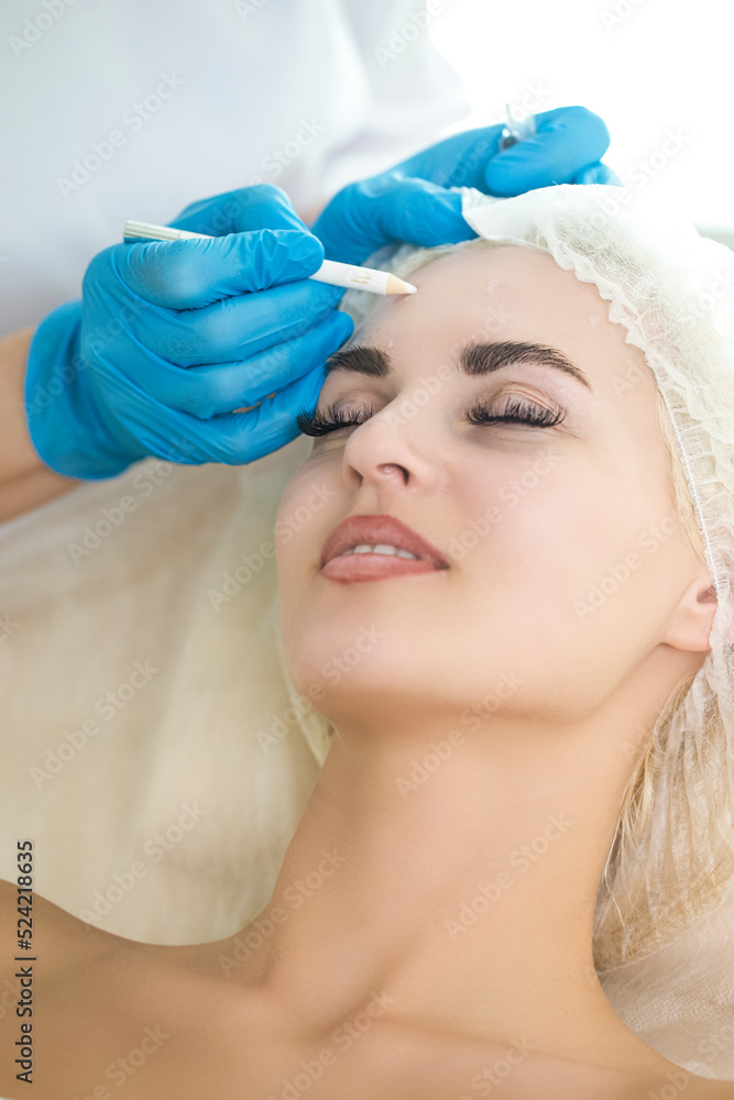 Facial Beauty Treatment While Preparing for Pigmentation Removal by Using Facial Pencil Markup Liner at Cosmetic Clinic Prior to Intense Pulsed Light Therapy IPL Or  Rejuvenation