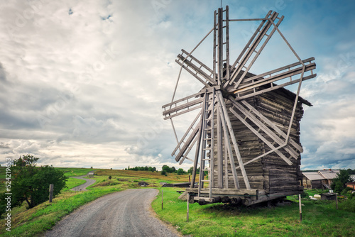 Kizhi Island  Karelia. A view of the wooden mill and road. Summer landscape.