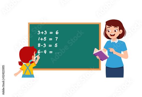 little kid solving math problem on blackboard