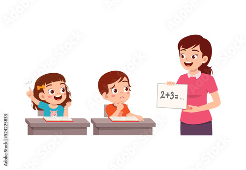 little kid study math in class with teacher