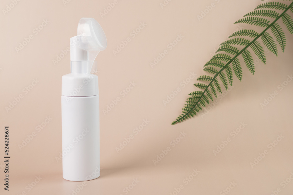 Facial foam in a bottle, Dispenser bottle with green leaf Facial foam in a bottle, Dispenser bottle with green leaf