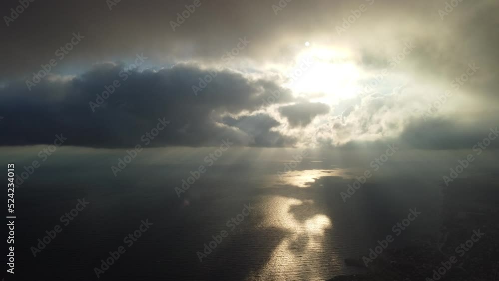 Abstract aerial nature summer ocean sunset sea and sky background. Small waves on clear water surface in motion blur with bokeh lights from sunrise. Holiday, vacation and recreational concept Abstract aerial nature summer ocean sunset sea and sky background. Small waves on clear water surface in motion blur with bokeh lights from sunrise. Holiday, vacation and recreational concept