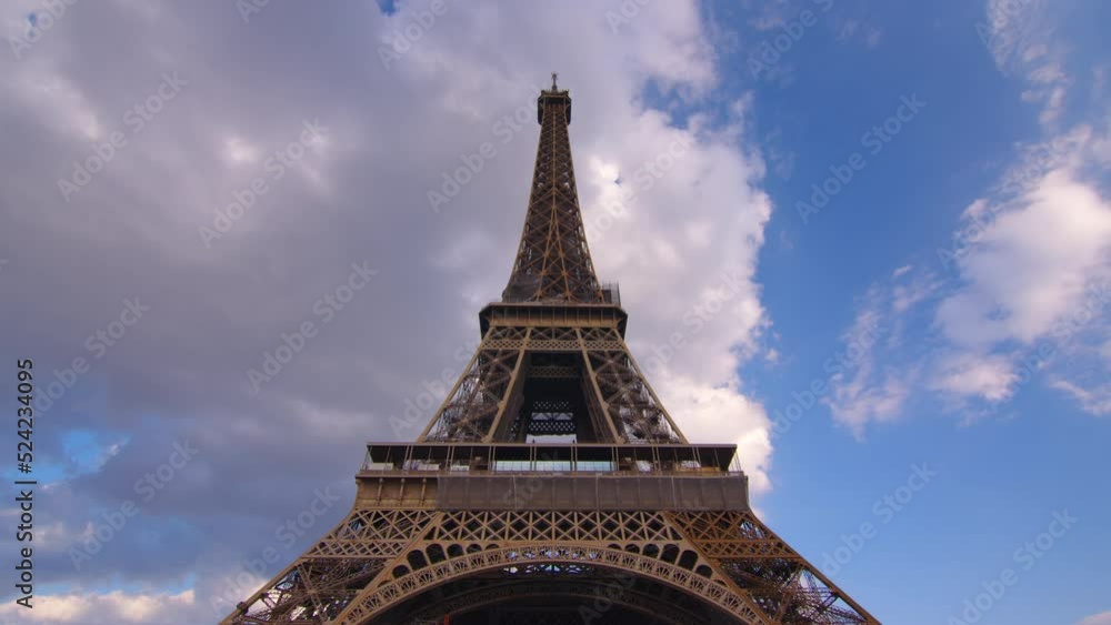 Timelapse, movement of clouds. Sunset, dusk, Eiffel tower, blue sky, top view, paris, 4k, time lapse, France. The most popular tourist attraction in the world. Timelapse, movement of clouds. Sunset, dusk, Eiffel tower, blue sky, top view, paris, 4k, time lapse, France. The most popular tourist attraction in the world.